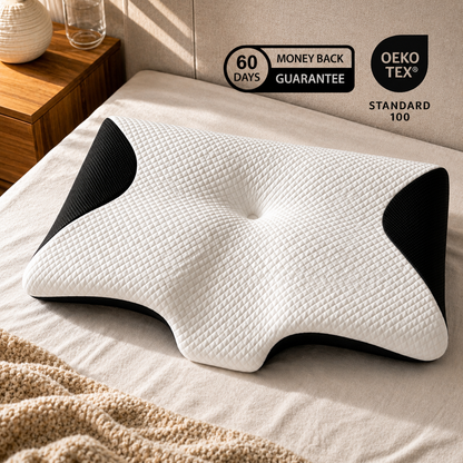 White and black pillow on a bed with Oeko-Tex and money-back guarantee logos.